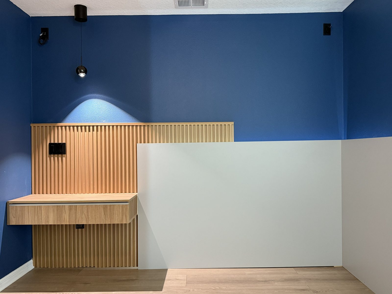 Fluted oak slat feature wall with floating drawer