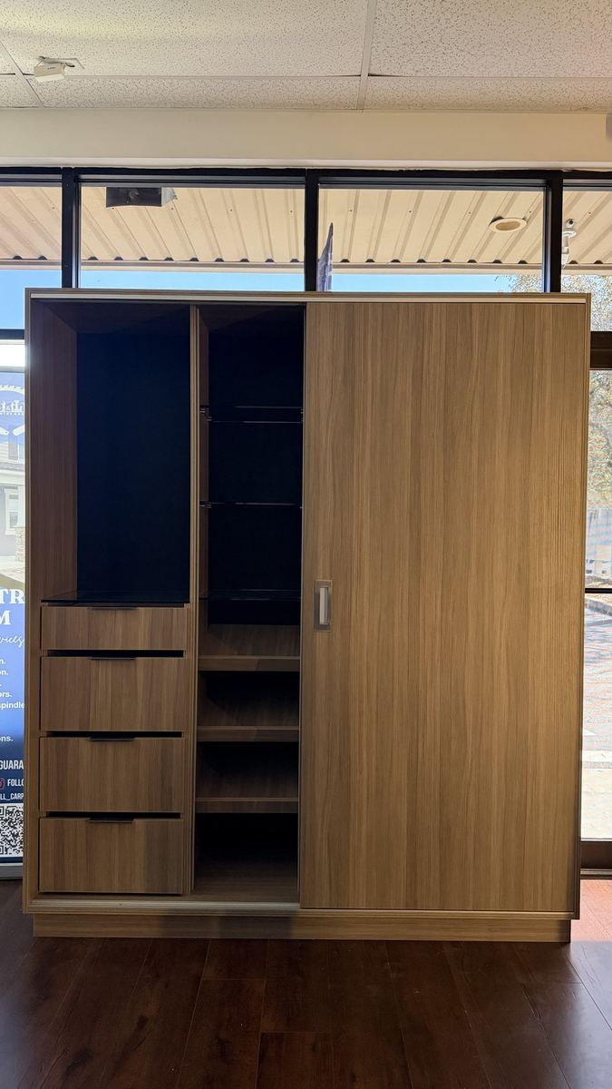 Walnut and navy wardrobe display in the Karino showroom