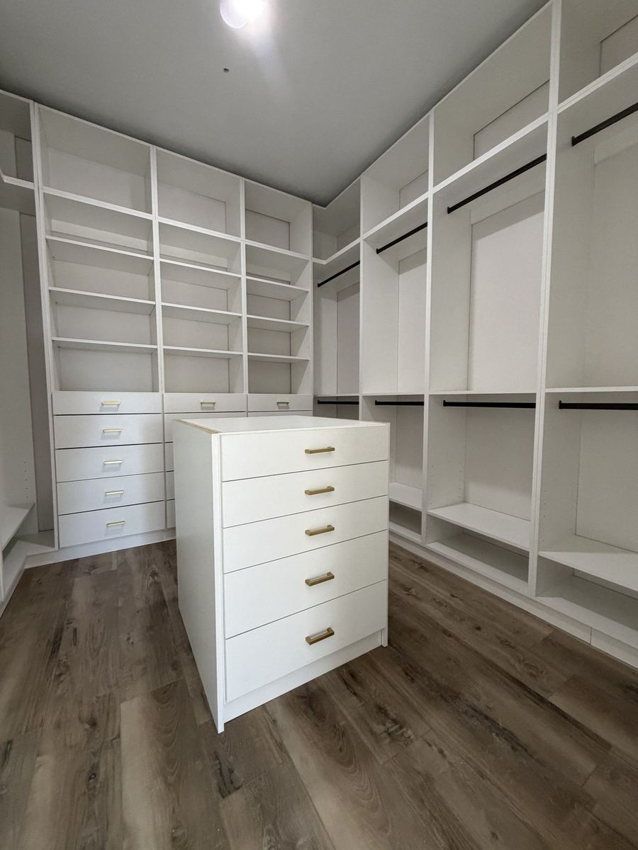 Walk-in closet island dresser with brass hardware